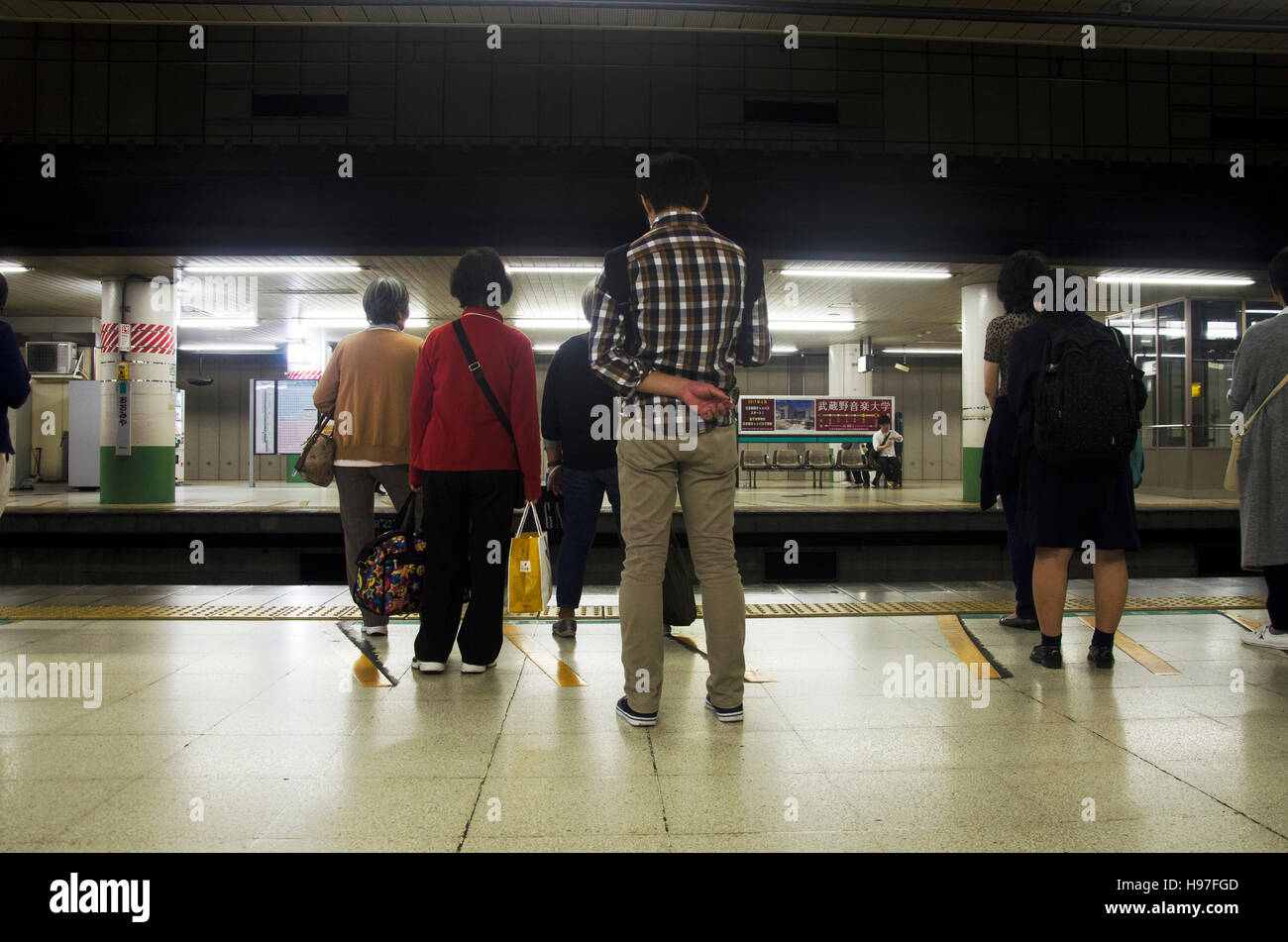 Japanese people and foreigner traveller waiting subway train go to Tokyo city at Omiya railway station in Kanto region on October 19, 2016 in Saitama, Stock Photo