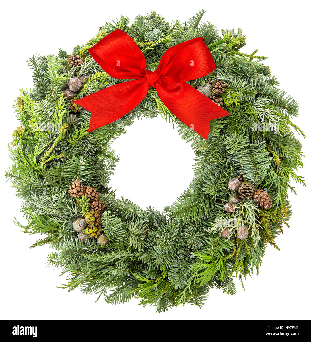 Christmas wreath from fir, pine and spruce twigs with cones and red ...