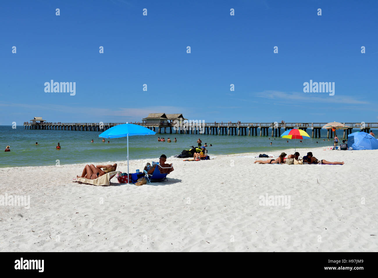 Naples, Florida, USA sandy beach and pier on the Golf Cost Stock Photo