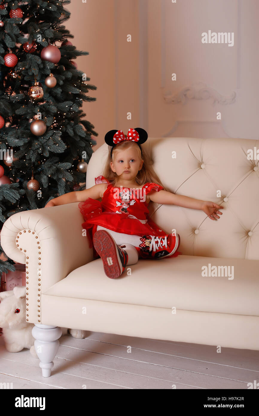 The girl in a mouse costume at Christmas Stock Photo