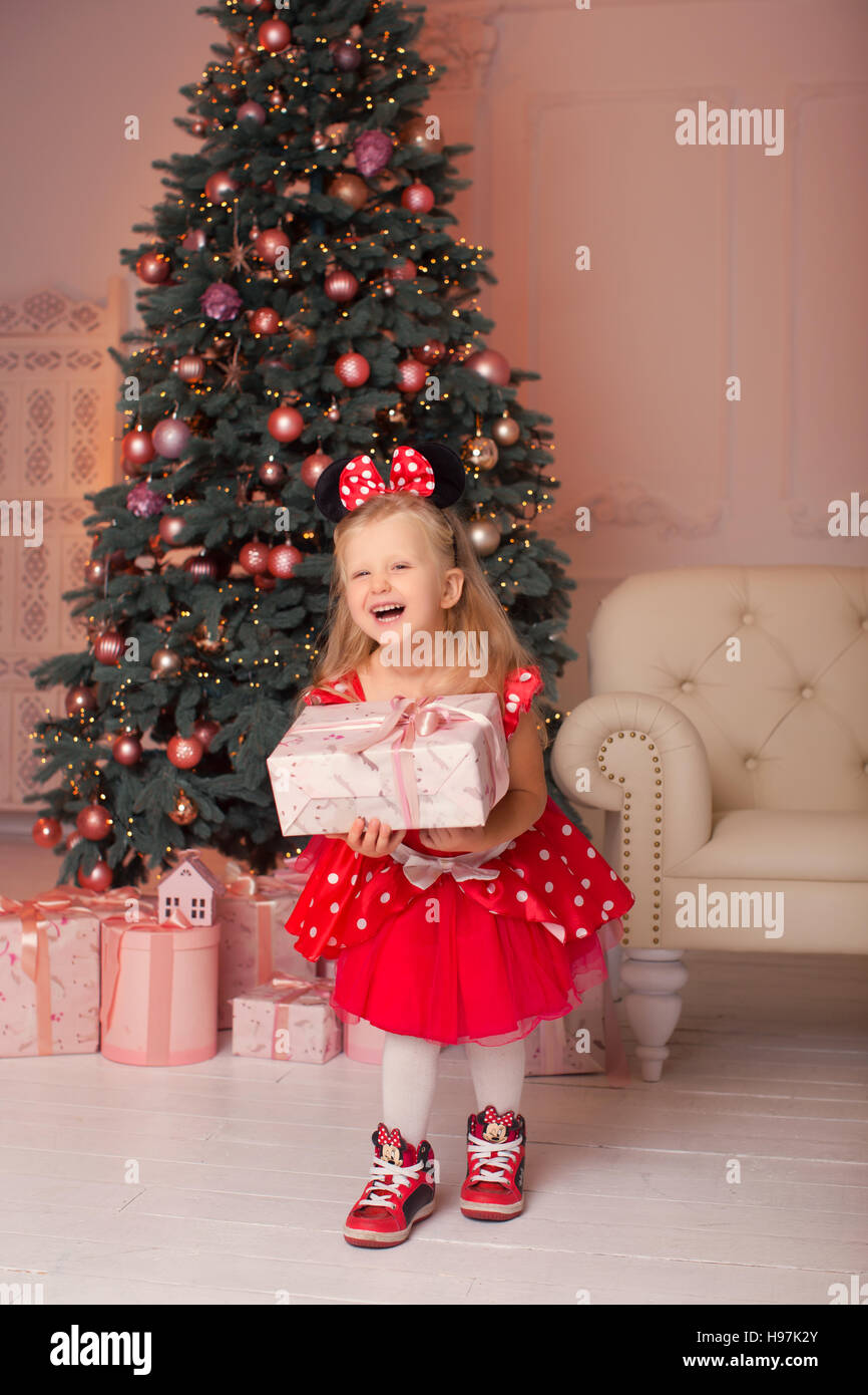 The girl in a mouse costume at Christmas Stock Photo