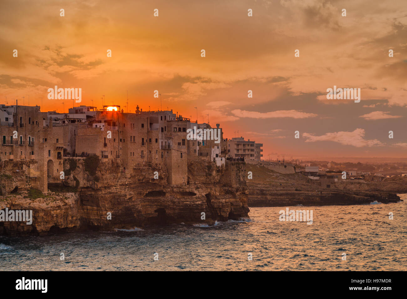 sunset on seaside village in Apulia, Italy Stock Photo - Alamy