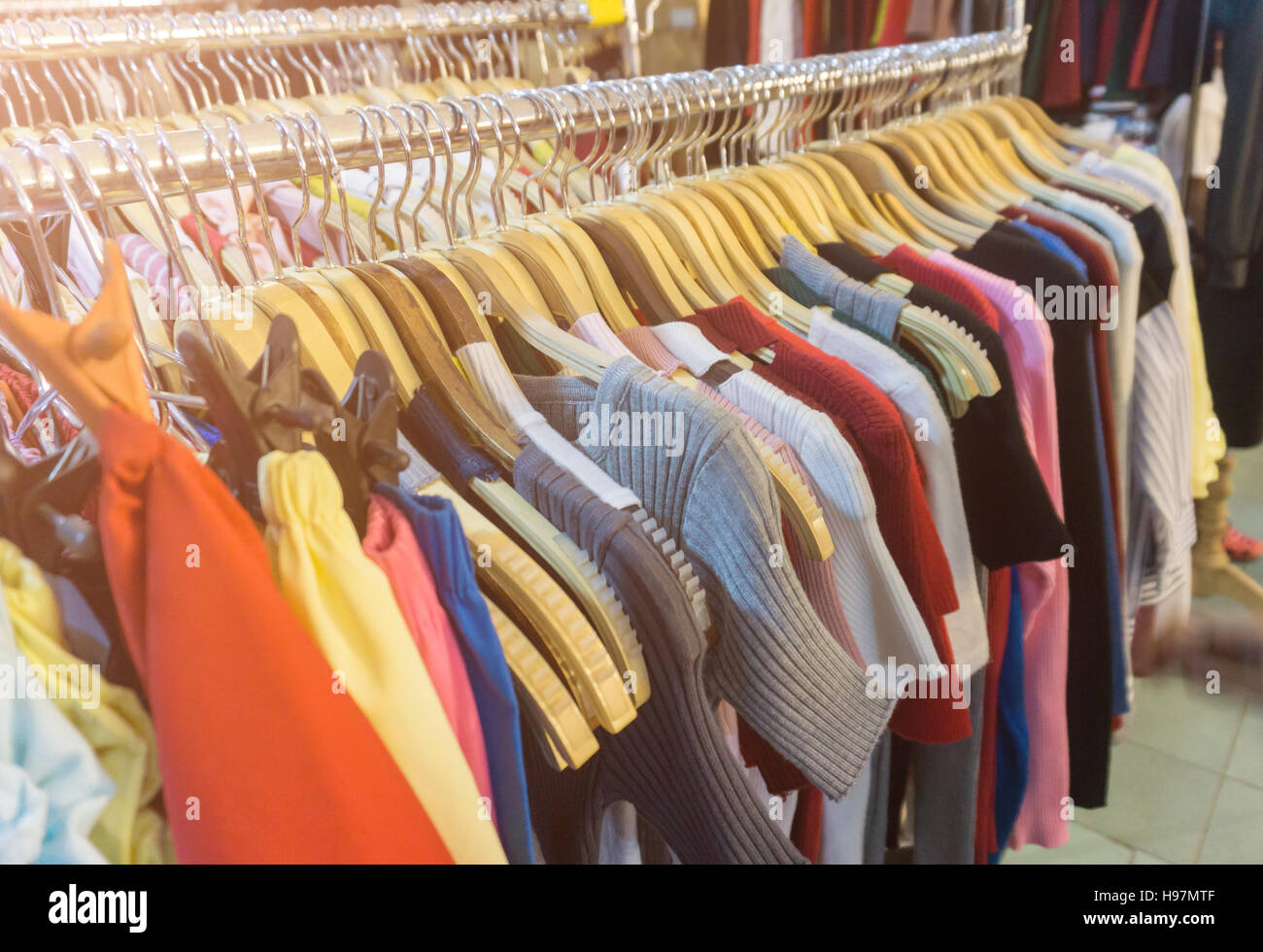 fashion clothing on hangers at the show Stock Photo - Alamy