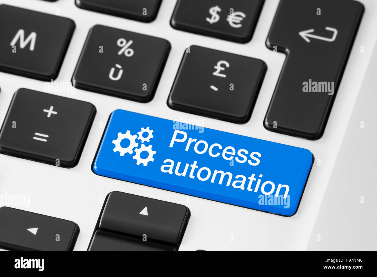 Process automation concept, close-up of button on computer keyboard, technology and business Stock Photo