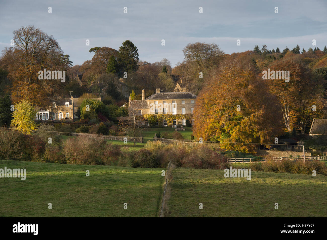 Manor house in Bourton on the hill in autumn at sunset. Cotswolds, Gloucestershire, England. Stock Photo