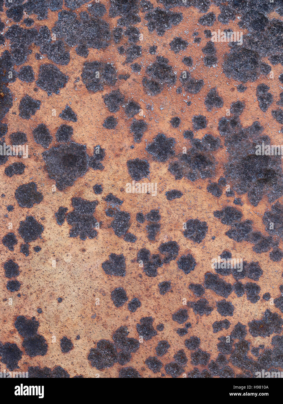 Detail of the rusty and worn surface of the iron plate Stock Photo