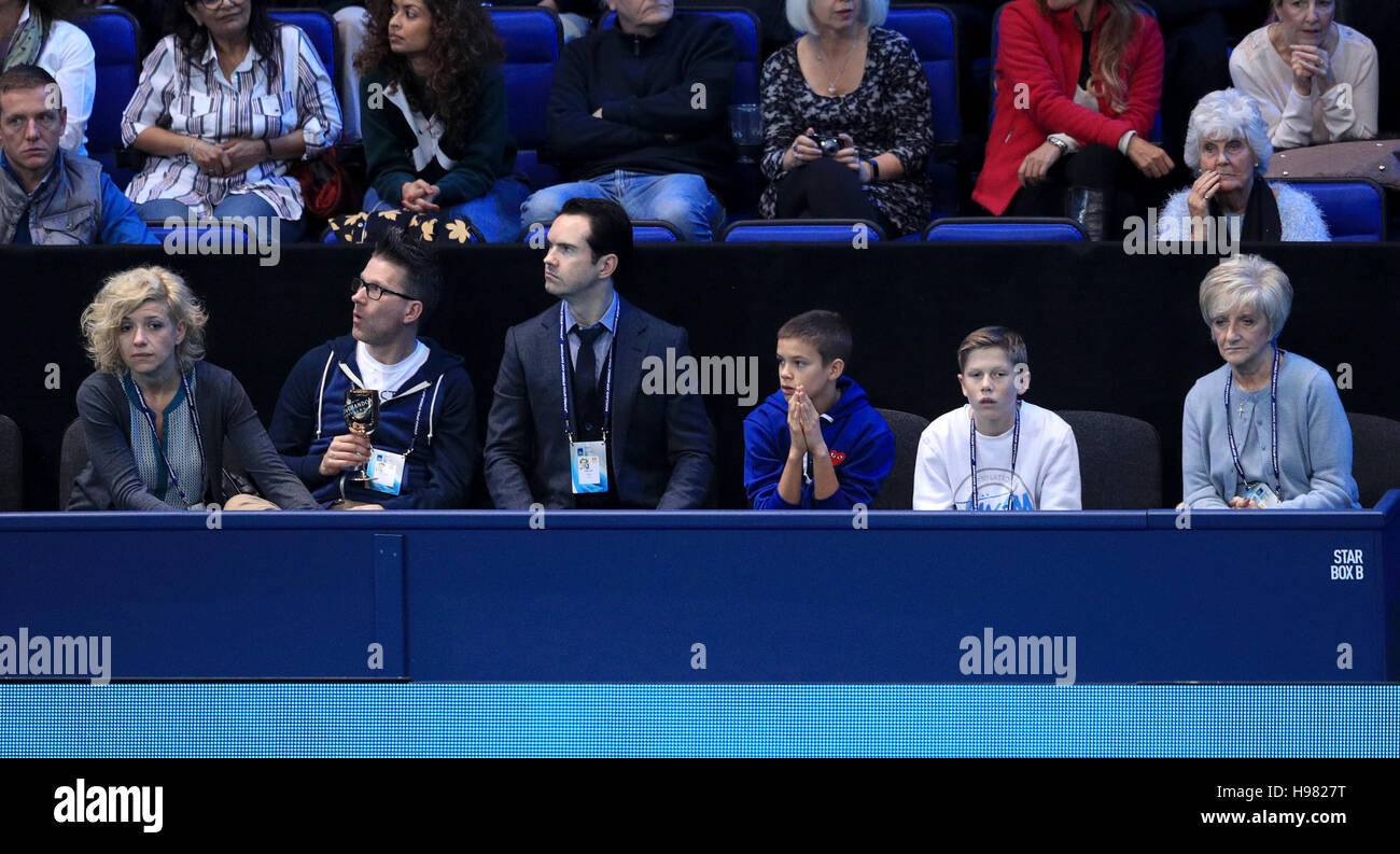 Comedian Jimmy Carr (centre) watches Andy Murray in his match against ...