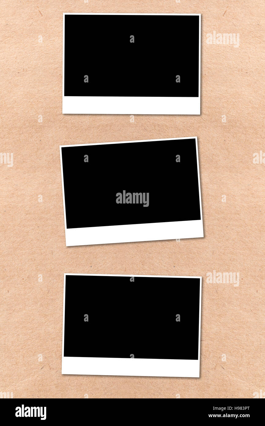 empty photographs on a background beige paper texture Stock Photo