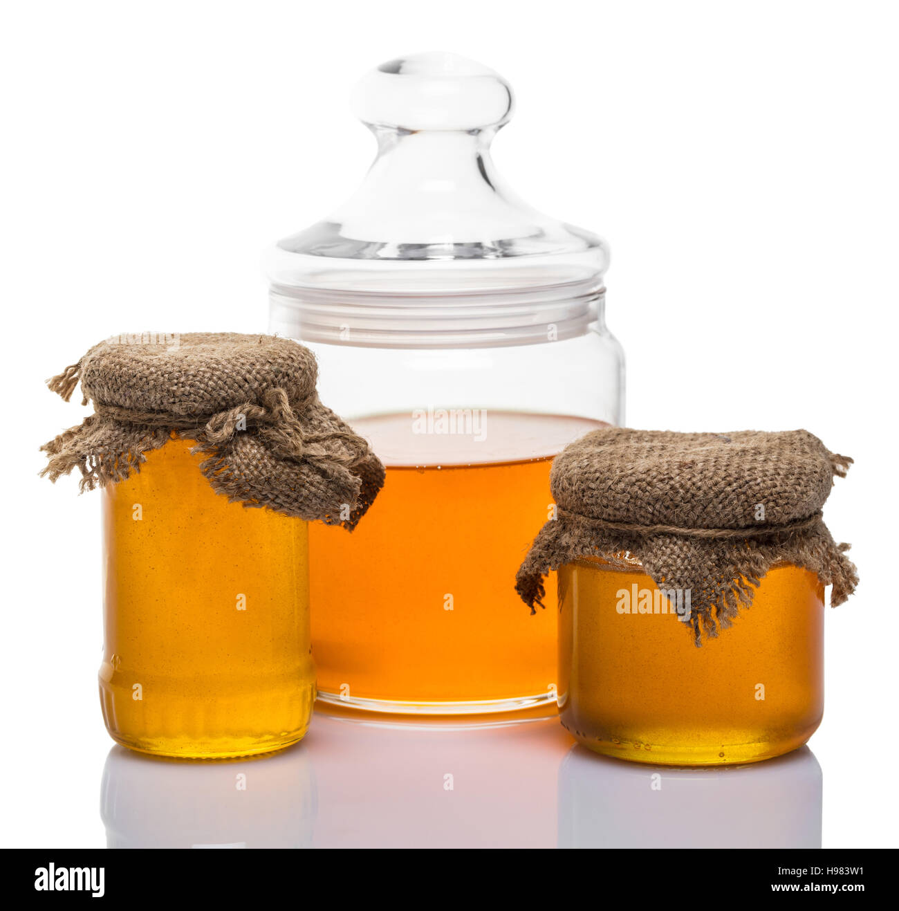 glass jars of honey on white background Stock Photo Alamy