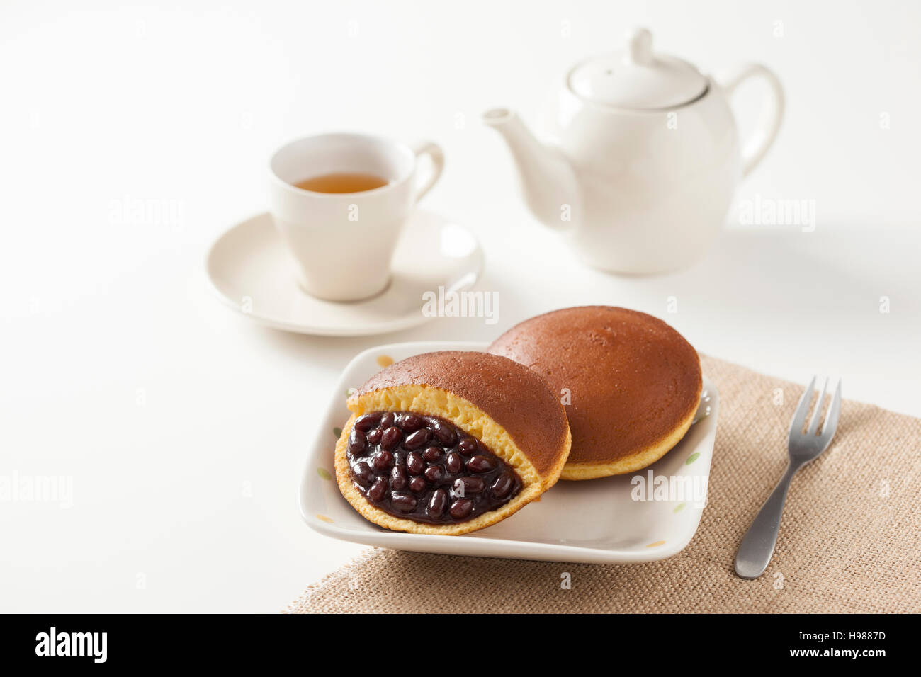Traditional Japanese Red Bean Pancake, Dorayaki, with tea and teapot