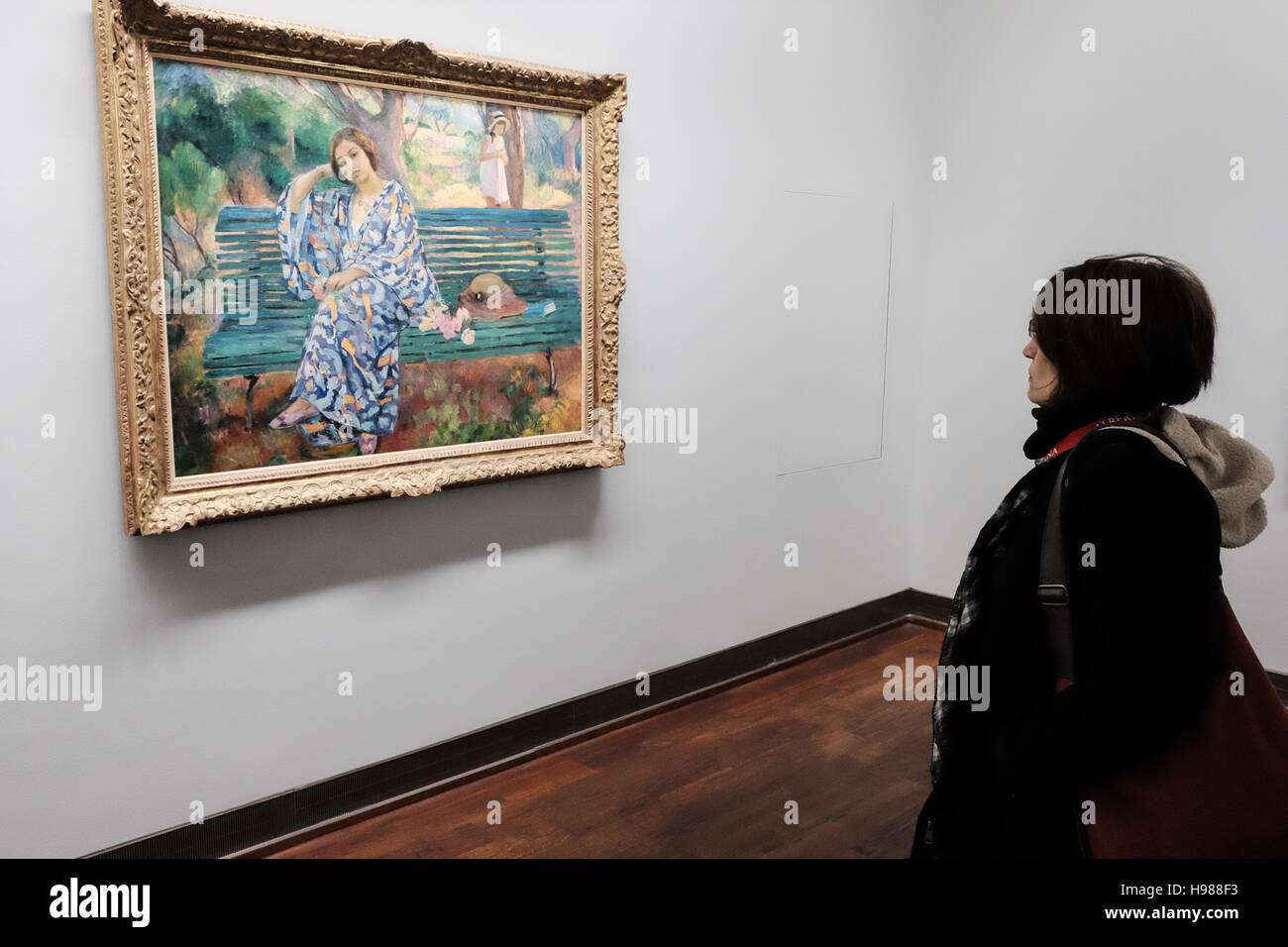 Visitors enjoy oil paintings at the Albertina Museum in Vienna, Austria. Stock Photo