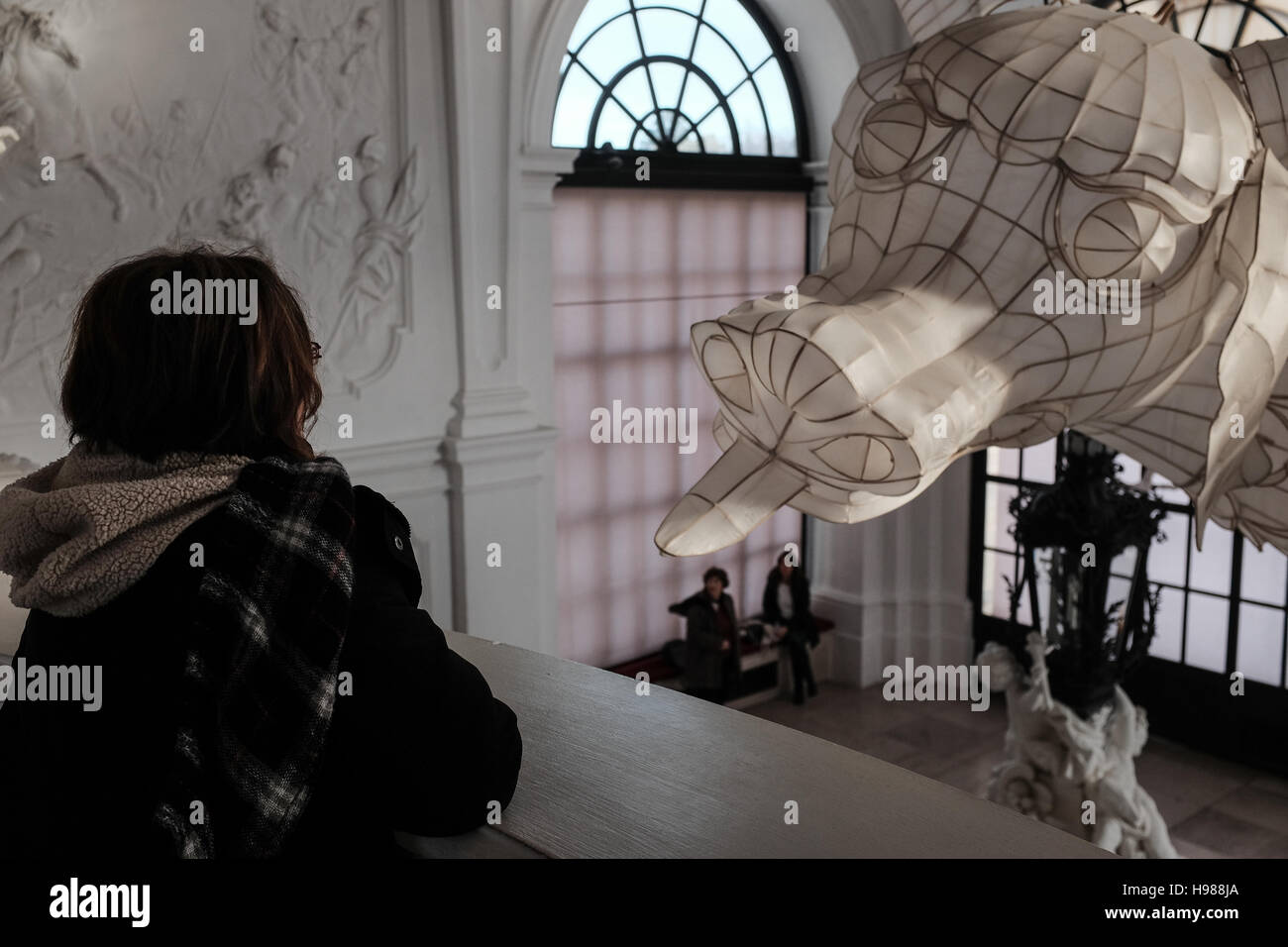 A woman admires an art piece, part of the exhibition Translocation - Transformation, by conceptual artist, documentarian and activist, Ai Weiwei, at t Stock Photo