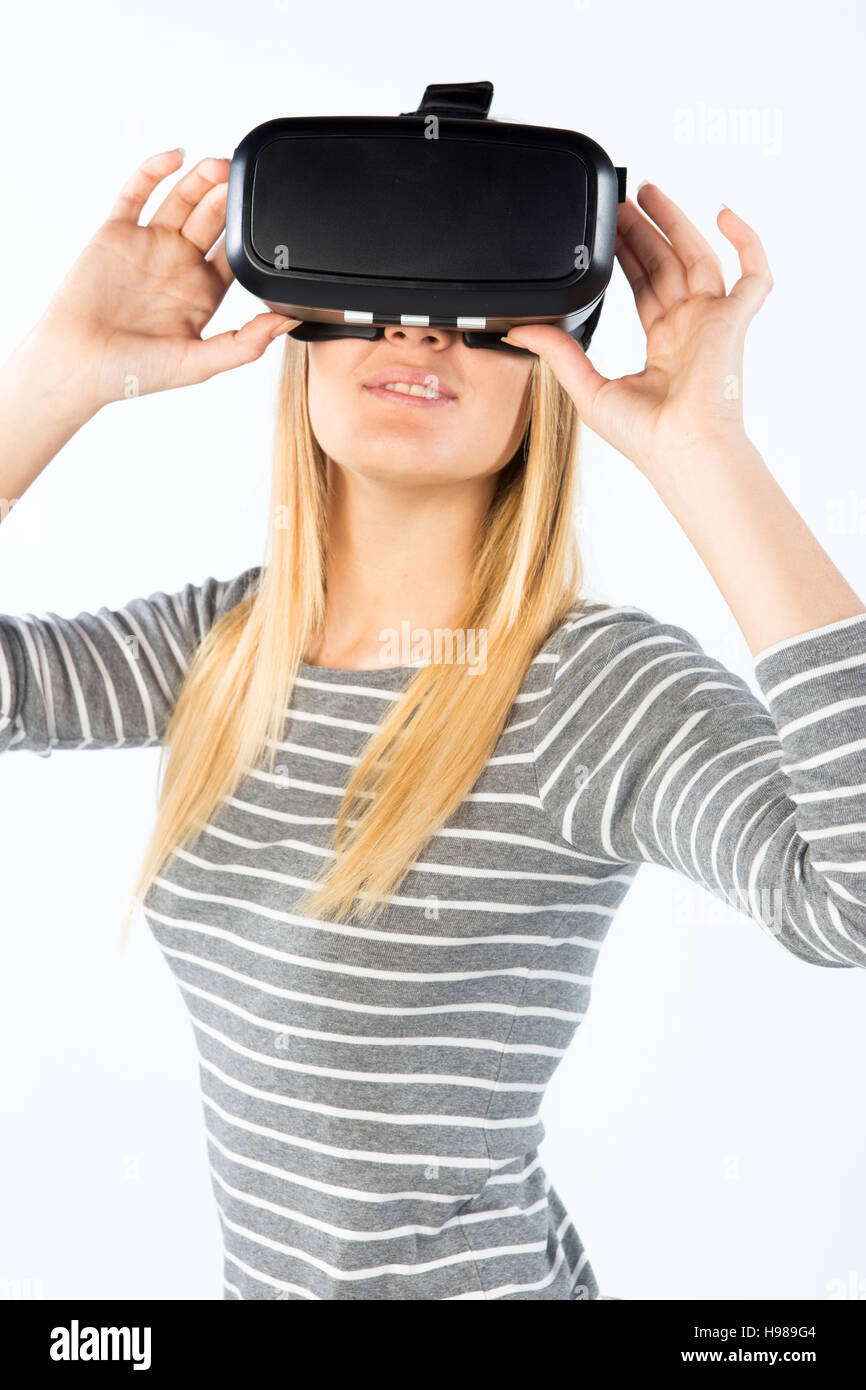 Happy beautiful girl wearing virtual reality goggles VR 360 on isolated  white Stock Photo - Alamy