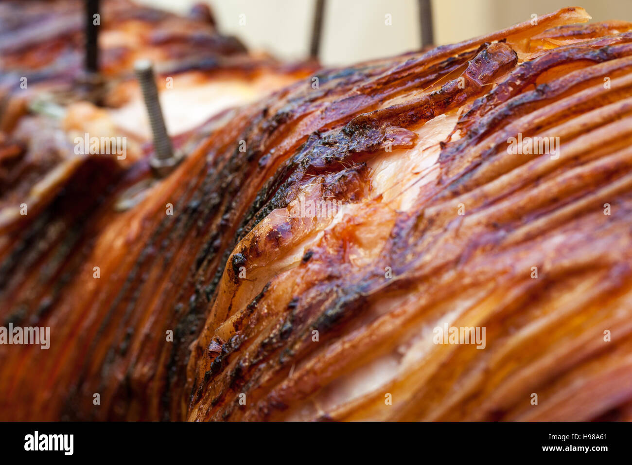 Hog Roast whole pig cooked over charcoal for a large gathering Stock
