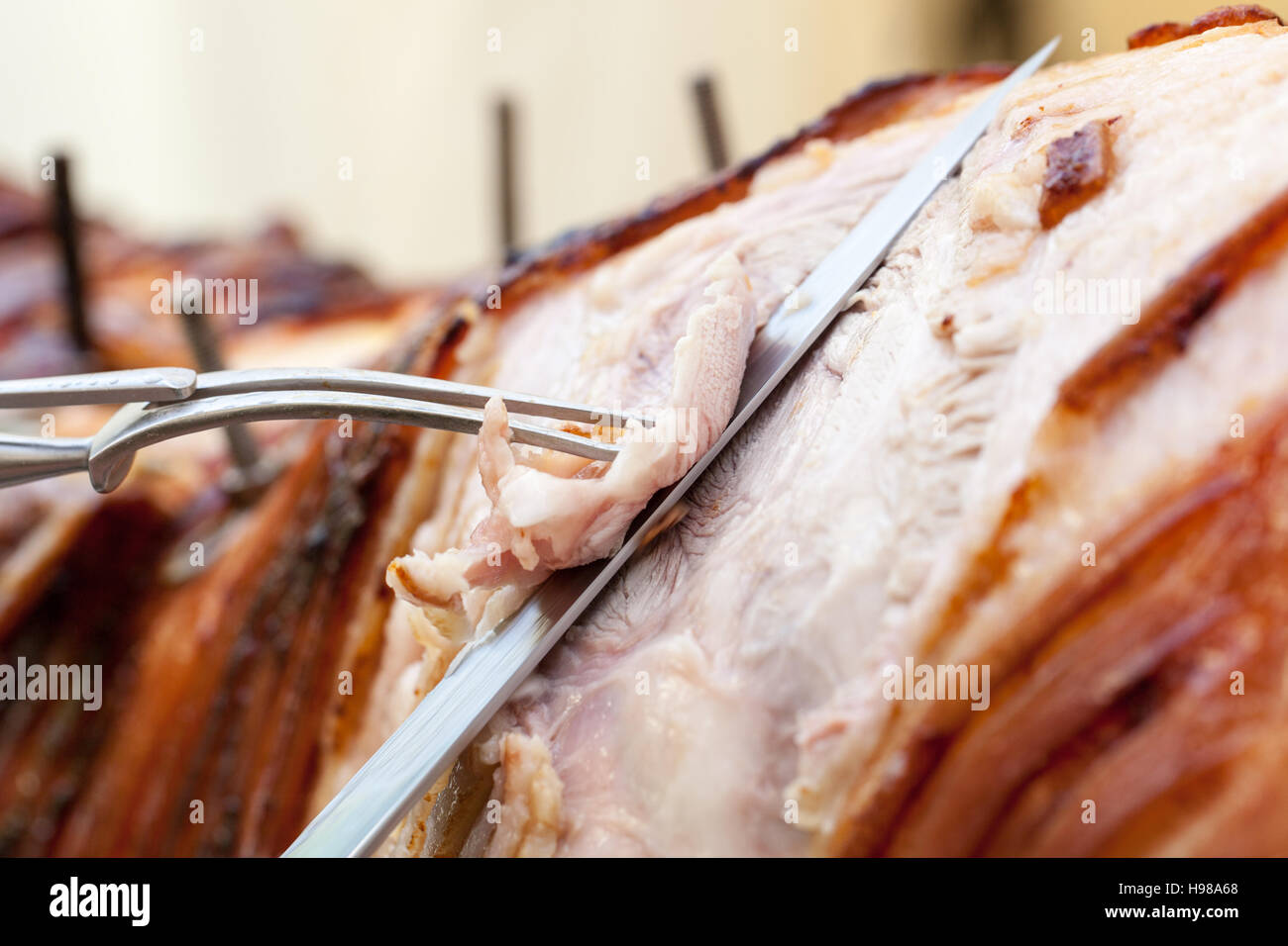 Hog Roast whole pig cooked over charcoal for a large gathering Stock