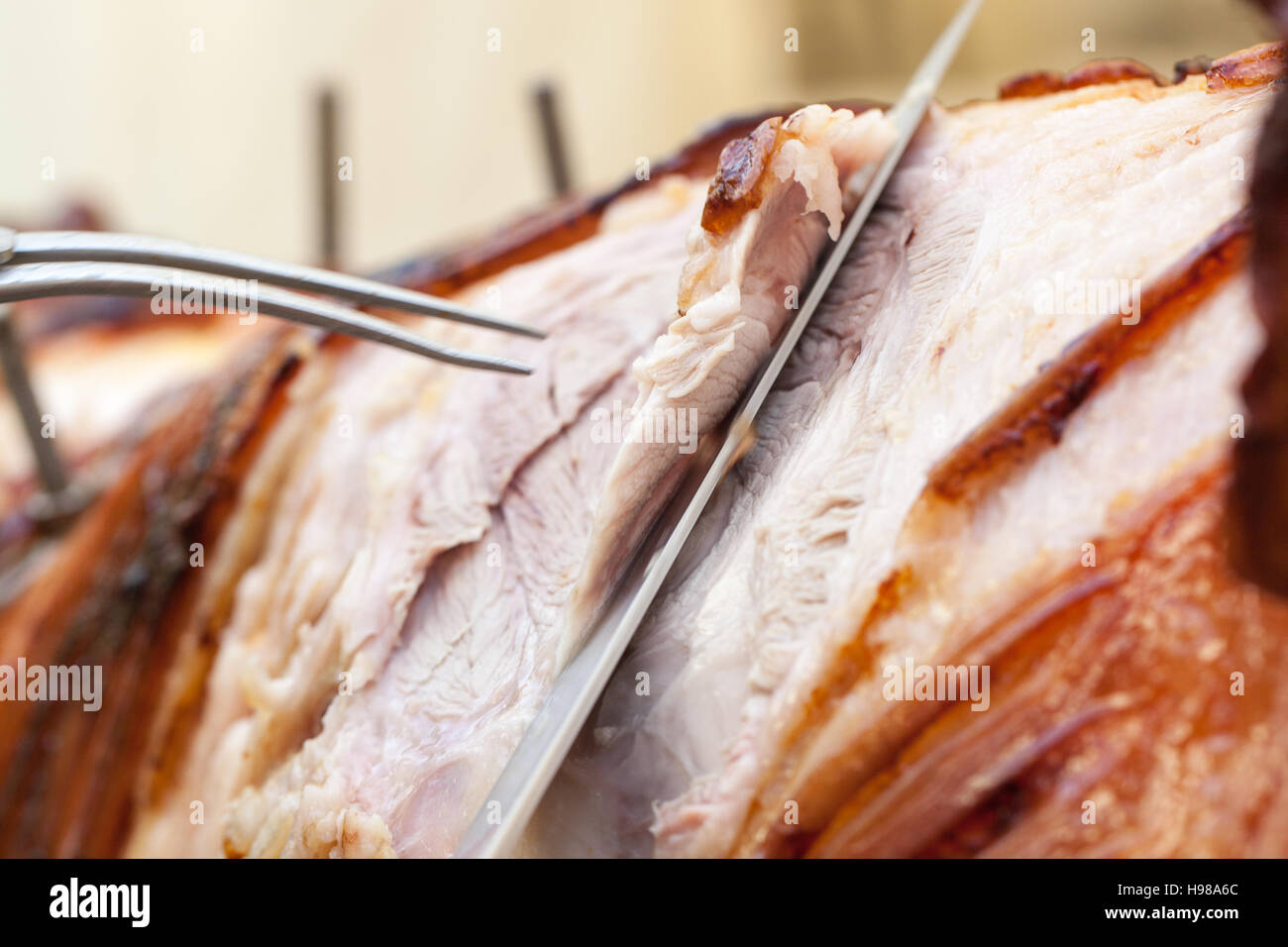 Hog Roast whole pig cooked over charcoal for a large gathering Stock