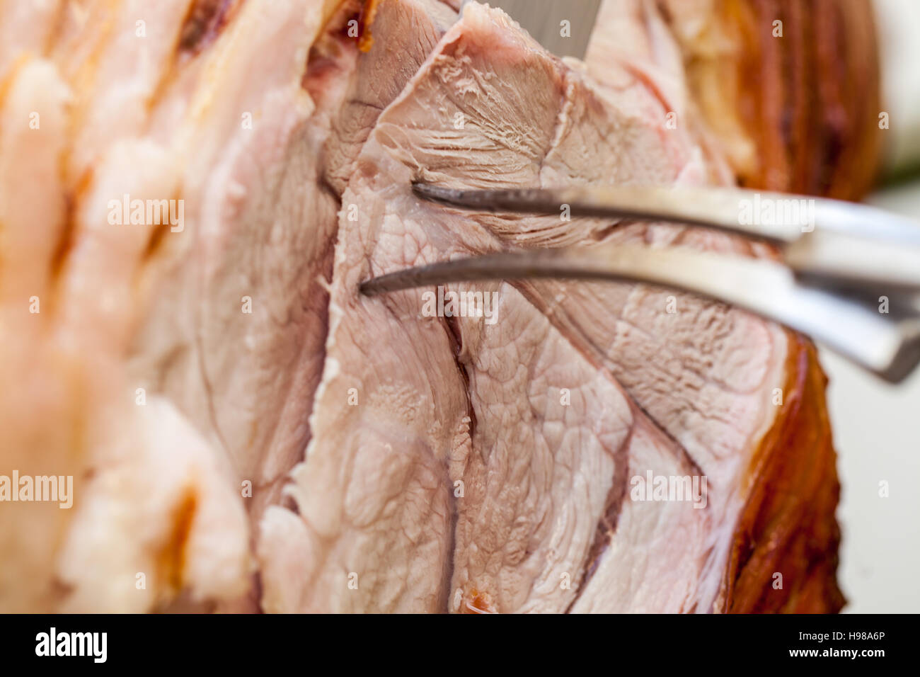 Hog Roast whole pig cooked over charcoal for a large gathering Stock