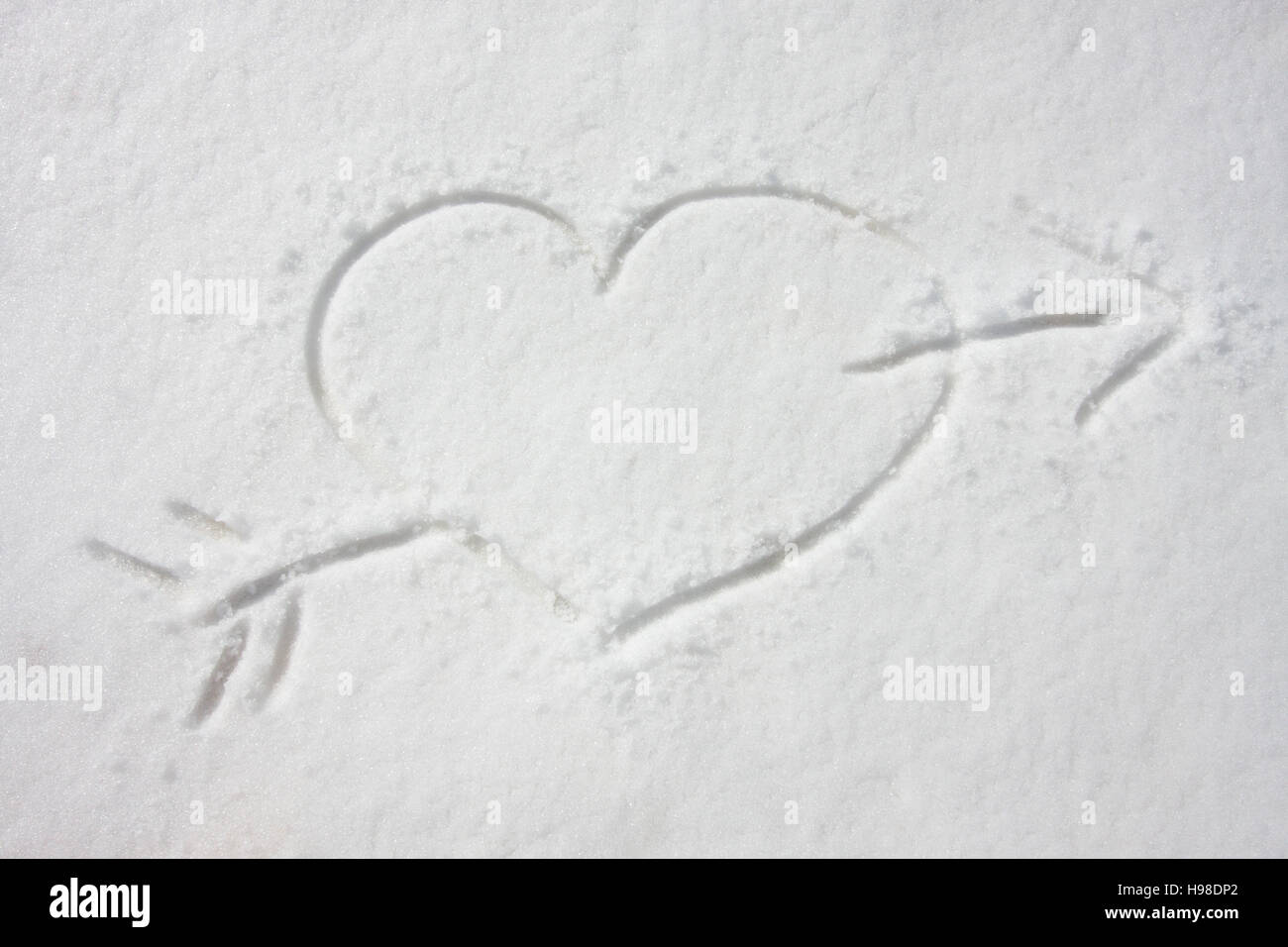 Heart drawn in snow Stock Photo - Alamy