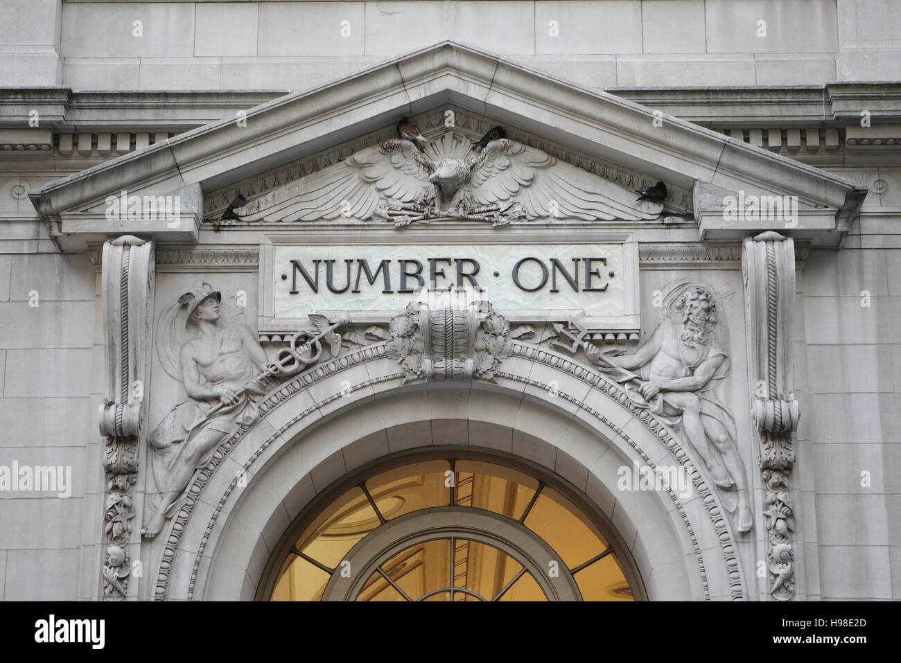 Schriftzug, Number One, above the entrance of a building in the city of New York, USA Stock Photo