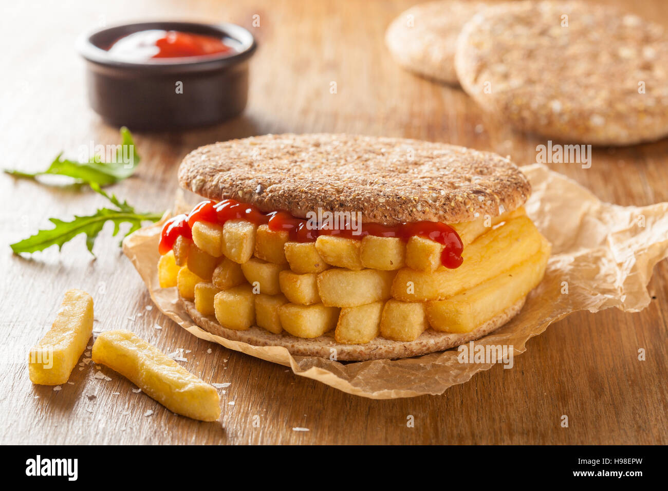 Chip Butty sandwich with potato chips or fries and ketchup Stock Photo