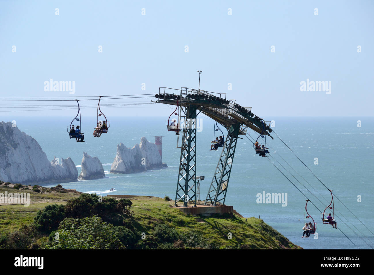 The chairlift at Alum Bay with the Needles Rocks and Lighthouse jutting out into the Solent on the Isle of Wight. Stock Photo