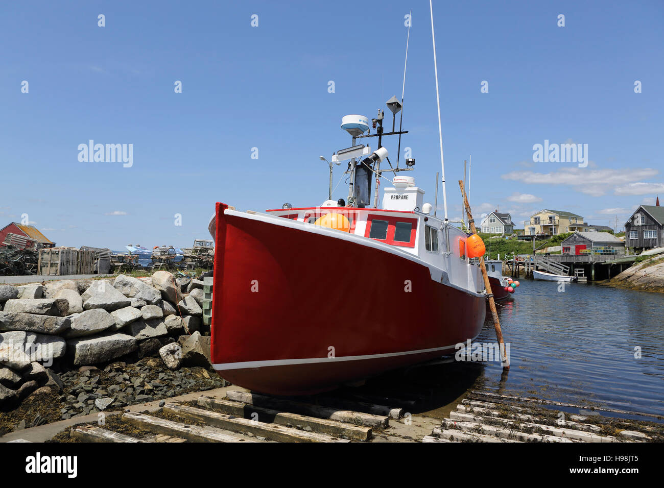 A Fishing Boat And Waterfront Huts And Houses In The Fishing Village Of Peggy S Cove In Nova