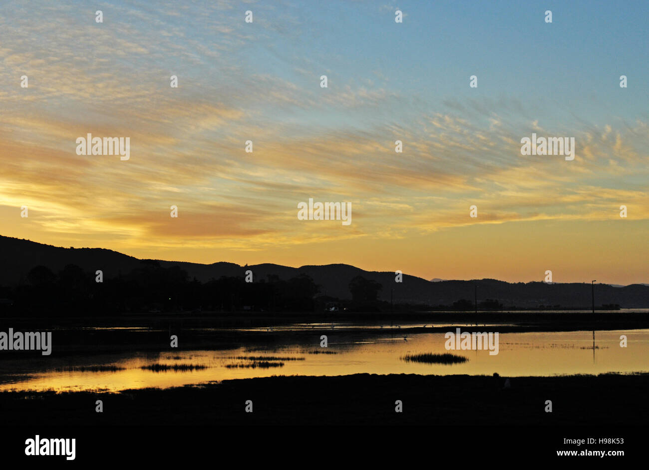 South Africa, Western Cape, Garden Route: golden sunset at the harbour of Thesen Islands, multi-award winning marina development in the city of Knysna Stock Photo