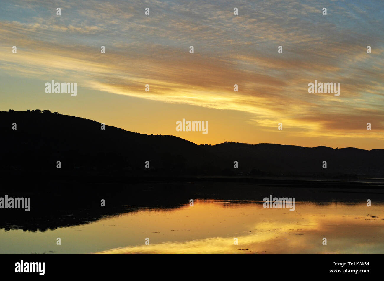 South Africa, Western Cape, Garden Route: golden sunset at the harbour of Thesen Islands, multi-award winning marina development in the city of Knysna Stock Photo