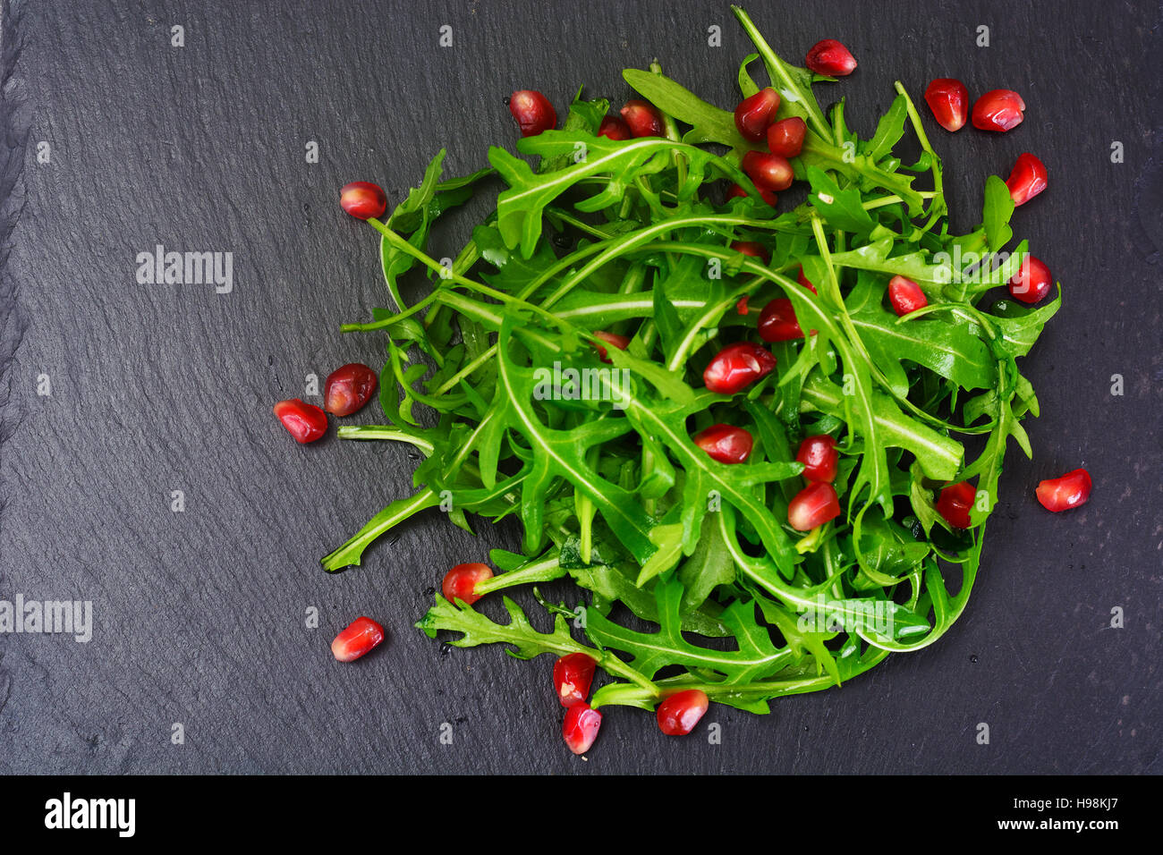 Fresh Arugula on Black background. Studio Photo Stock Photo - Alamy