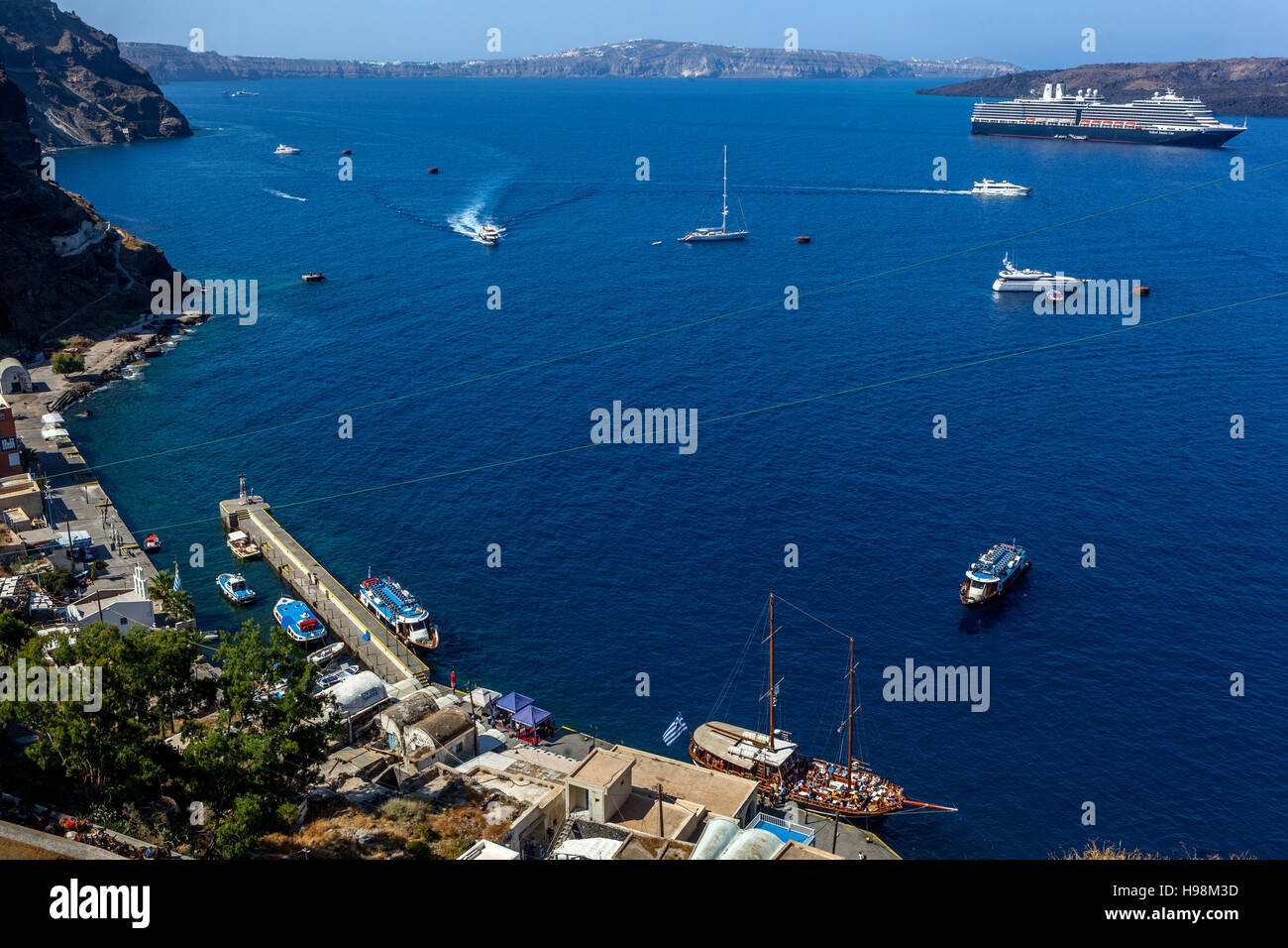 Cruises moored in the caldera, Santorini harbour, Aegean Sea, Cyclades Islands, Greece Stock Photo