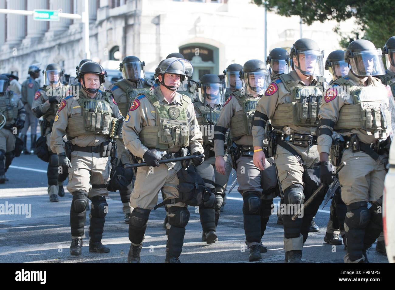 DPS officers in riot gear keep White Lives Matter marchers apart from those protesting against them near the Texas Capitol. Stock Photo