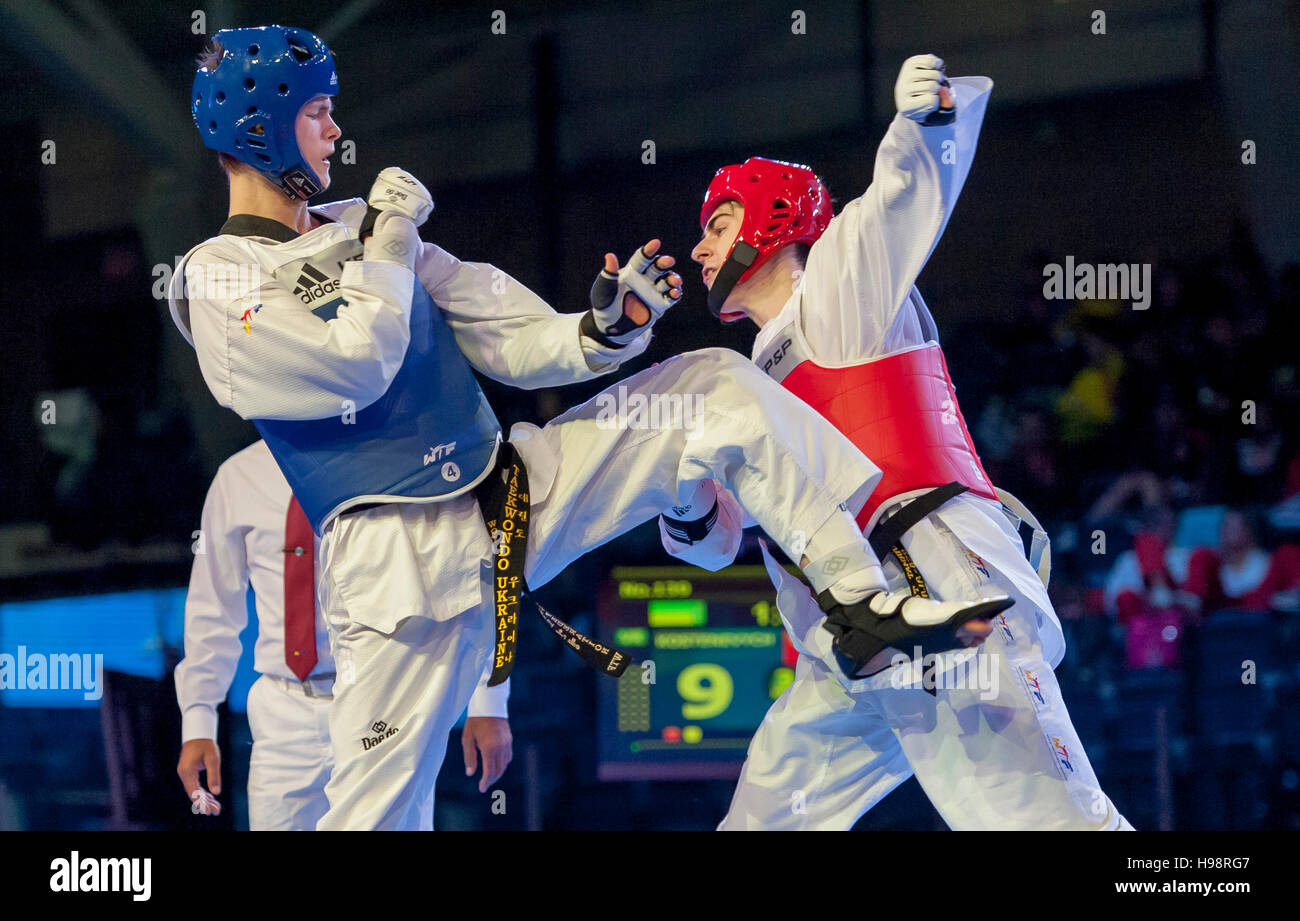 Burnaby, Canada. 19 November, 2016. WTF World Taekwondo Junior Championships Kostiantyn Kostenevych (UKR) and Sarmat Tcakoev  (RUS) red compete in the final of male 68kg won by Tcakoev. Alamy Live News/Peter Llewellyn Stock Photo