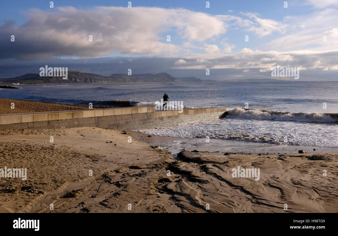 Lyme Regis Dorset, UK. 20th Nov, 2016. A walker enjoys the calm weather