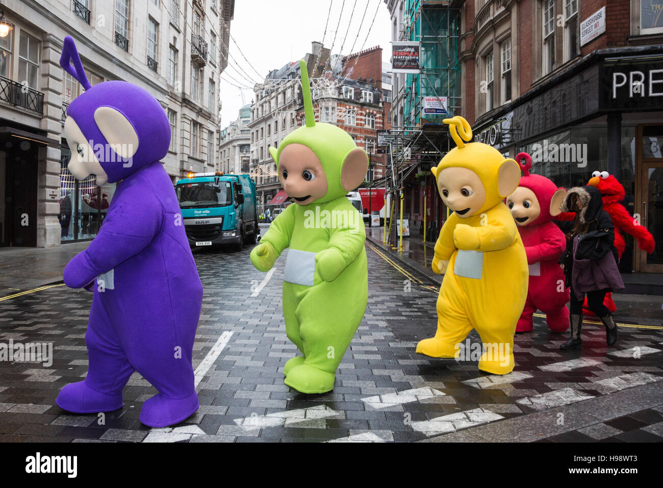 London, UK. 20 November 2016. Teletubbies on their way to the parade. The 2016 Hamleys Christmas Toy Parade takes place along Regent Street, which went traffic-free for the day. The parade organised by the world-famous toy store Hamleys featured over many of the nation's favourite children's characters along with entertainers, a marching band and giant balloons. The parade is modelled on Macy's annual Thanksgiving Parade in New York. Credit:  Bettina Strenske/Alamy Live News Stock Photo