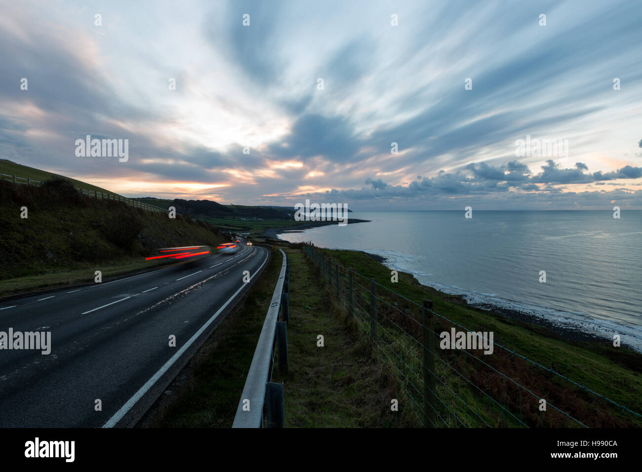Dark Sunset And Clouds As Seen From The A487 Coastal Road Overlooking Dark Sunset And Clouds As Seen From The A487 Coastal Road Overlooking
