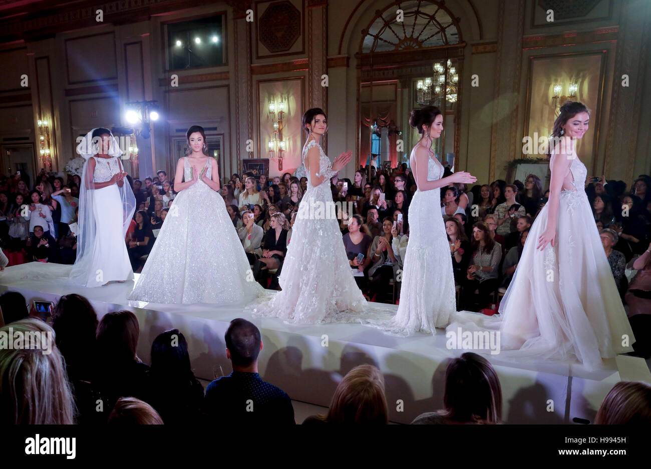 Vancouver, Canada. 20th Nov, 2016. Models show the luxury wedding dresses on stage during the CREME DE LA CREME Grand Wedding Showcase event in Vancouver, Canada, Nov. 20, 2016. The annual CREME DE LA CREME Grand Wedding Showcase is Vancouver's most luxury wedding show event showcasing hi-end wedding gowns, services, venue designs and wedding products for the high society brides. Credit:  Liang Sen/Xinhua/Alamy Live News Stock Photo