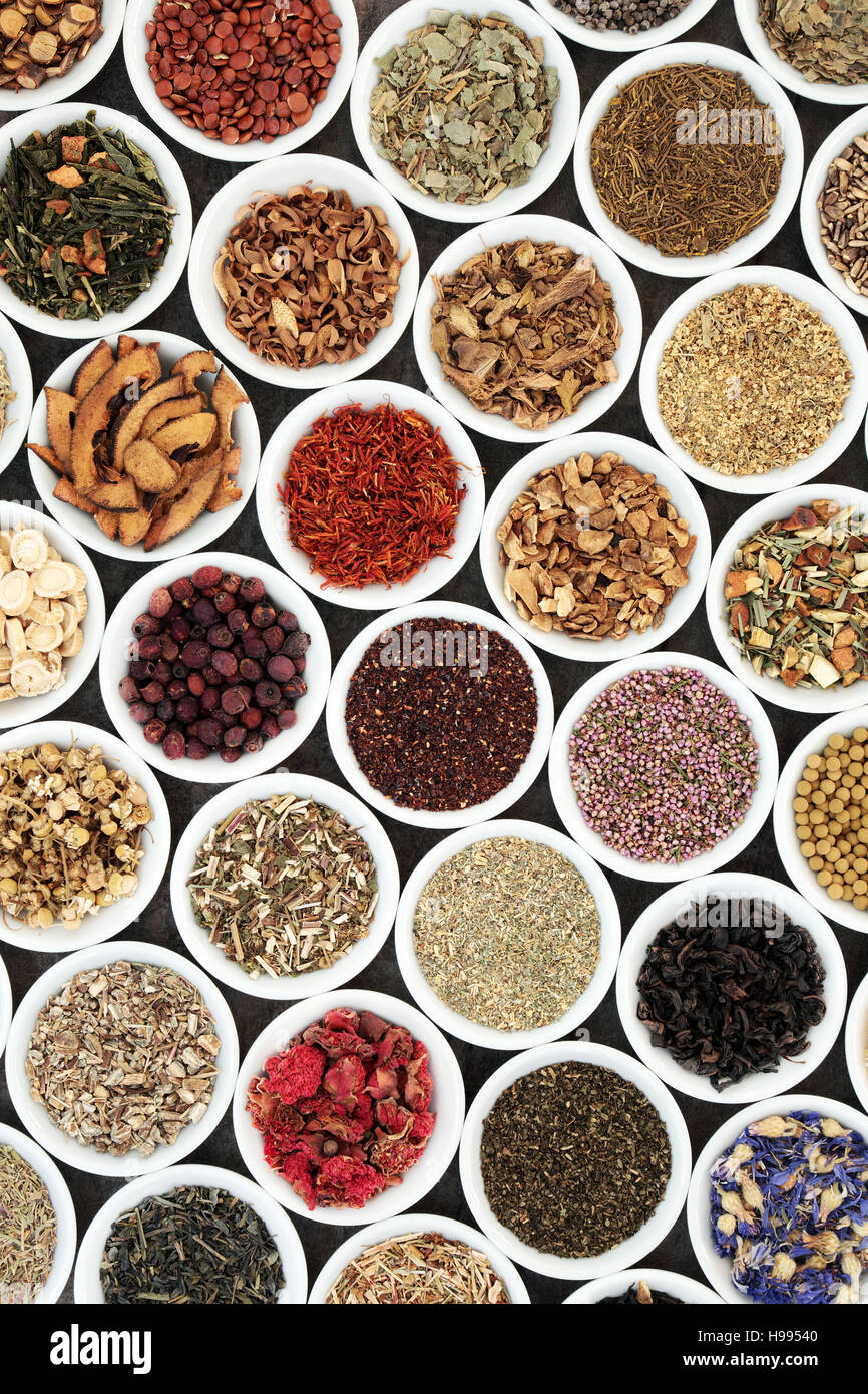 Herbal tea selection for good health in white porcelain bowls forming a background. Used also in