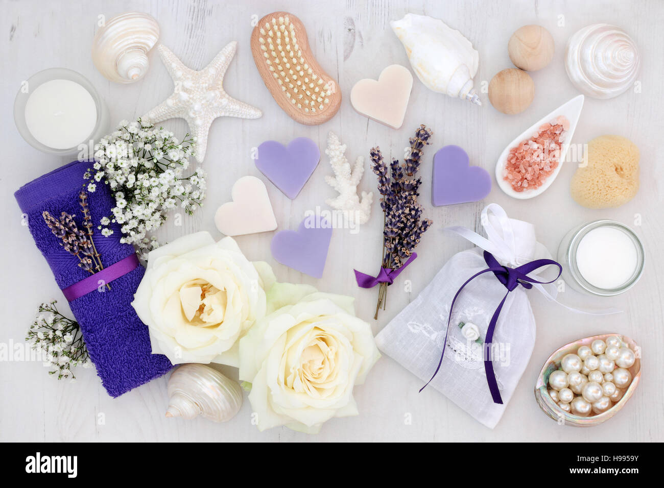 Lavender and rose flowers with spa and bathroom accessories Stock Photo