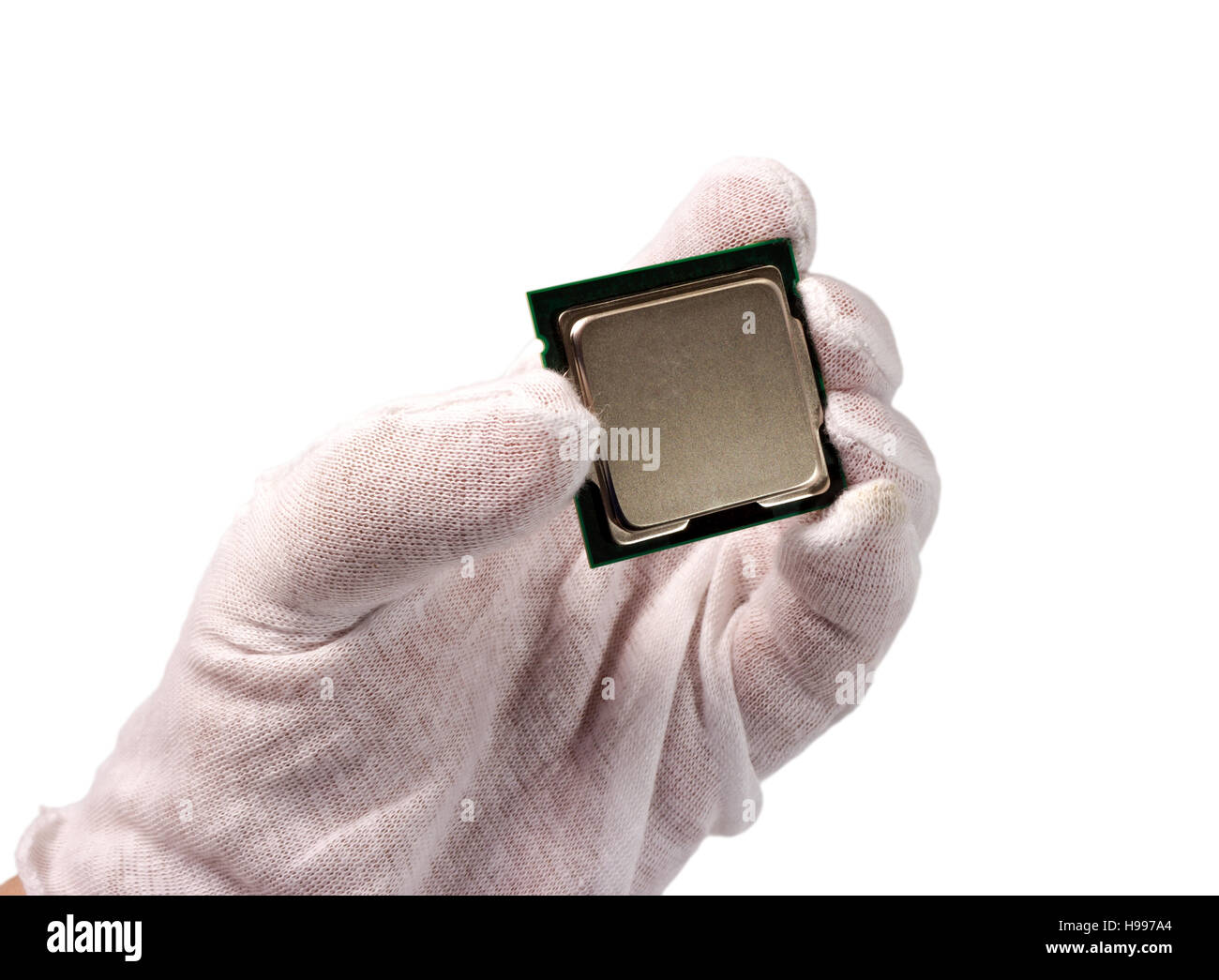 Electronic collection - Hand holds computer CPU processor chip from the top side isolated on white background Stock Photo