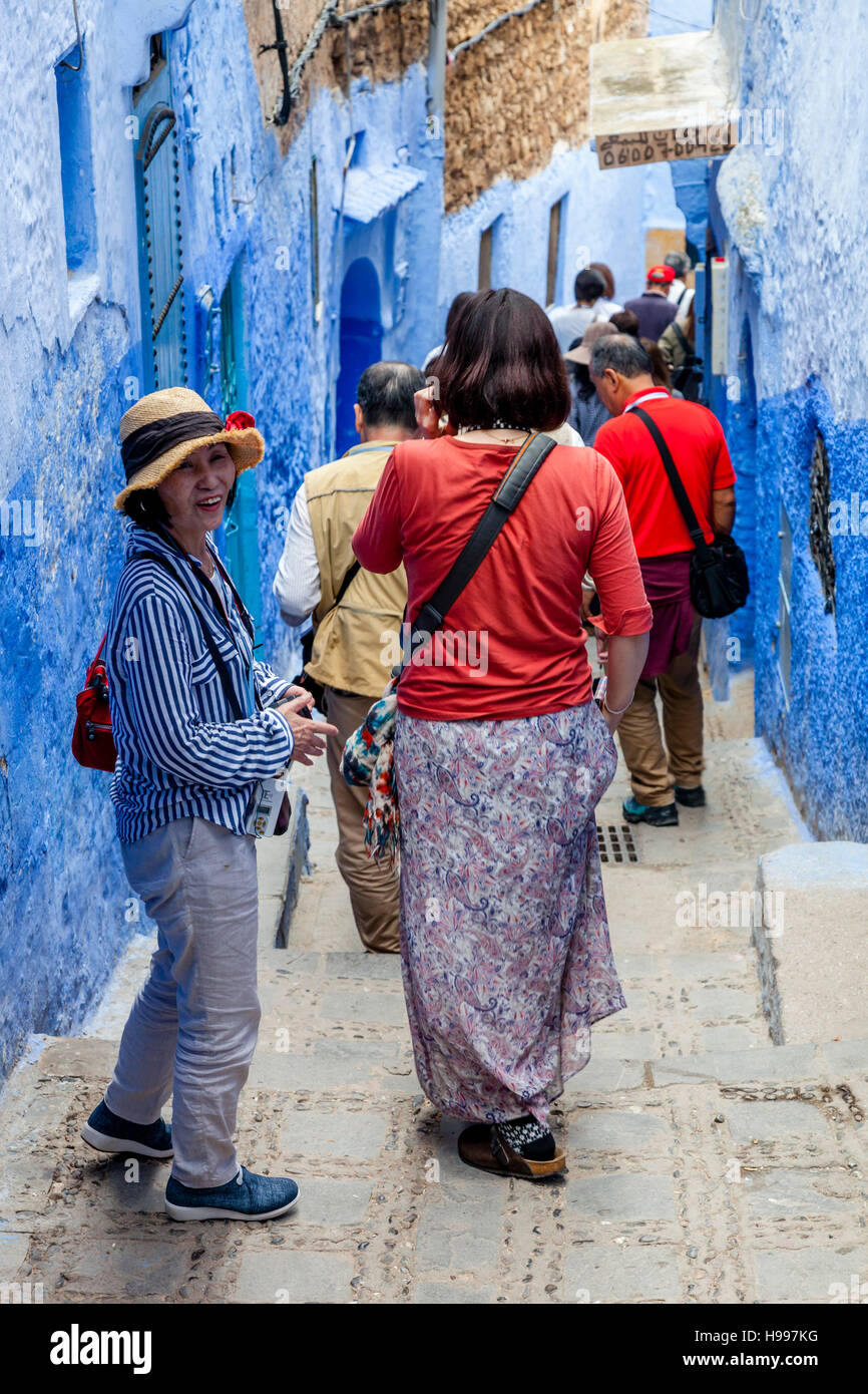Chinese Tourists In The Medina, Chefchaouen, Morocco Stock Photo