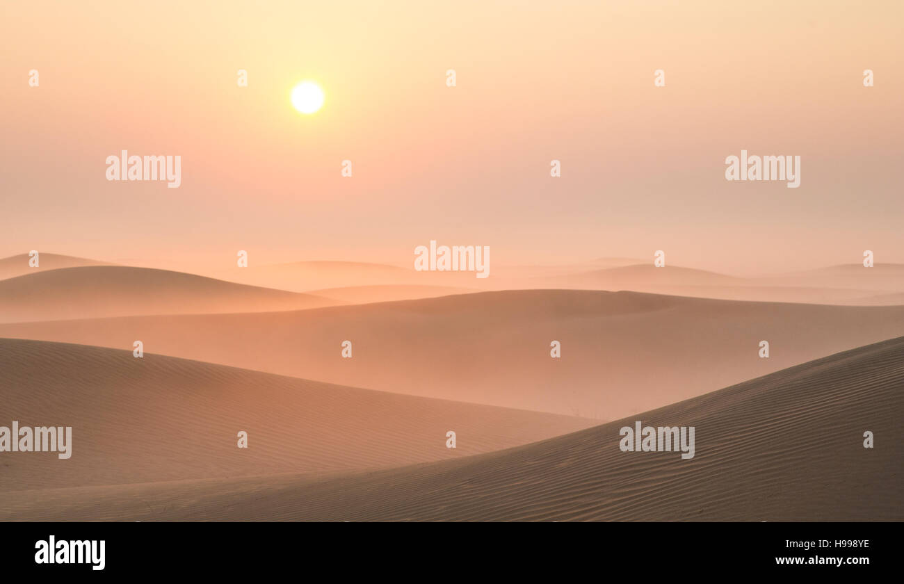 Mist in a desert at sunrise near Dubai, UAE Stock Photo