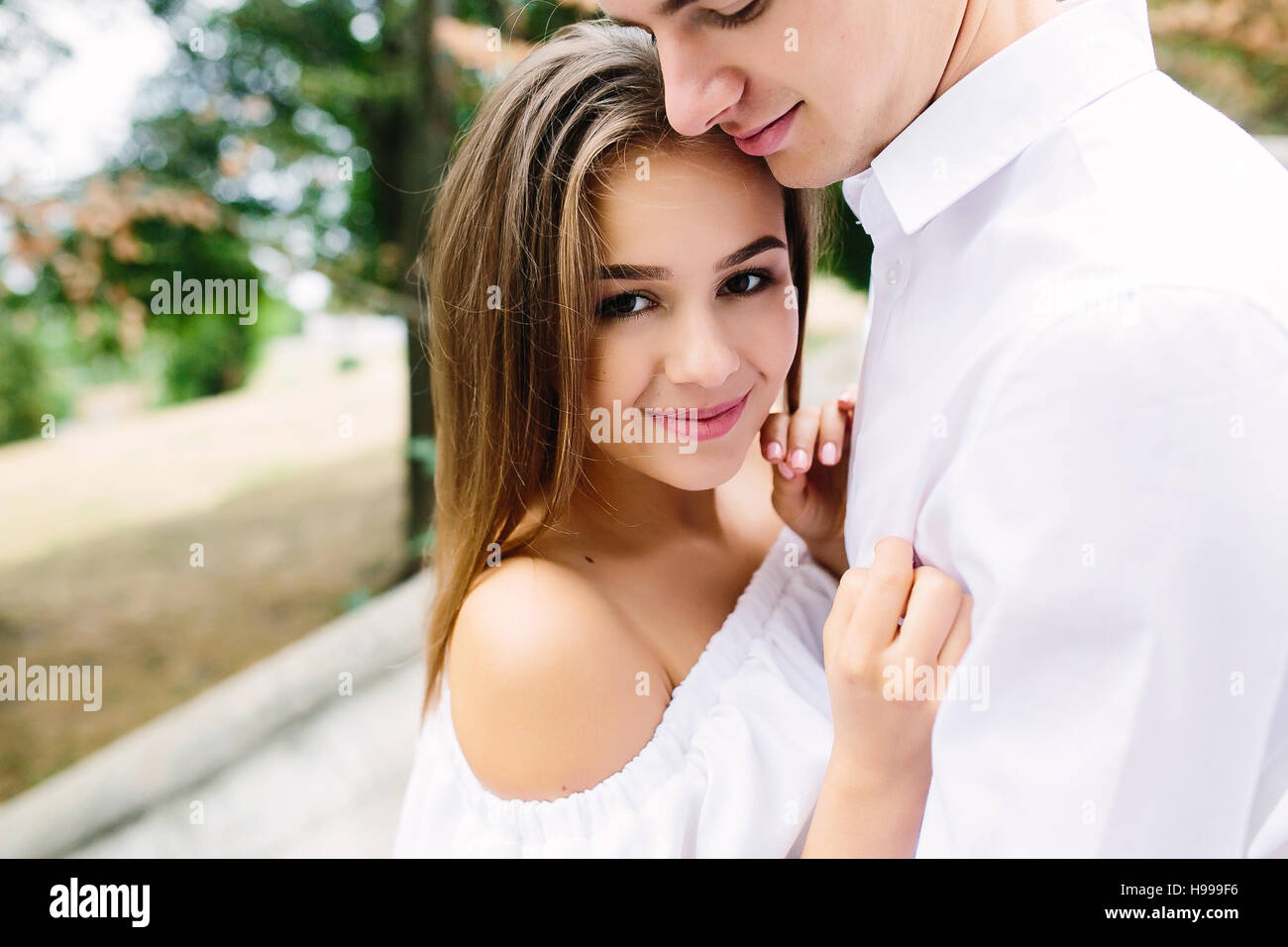 couple posing in the park Stock Photo - Alamy