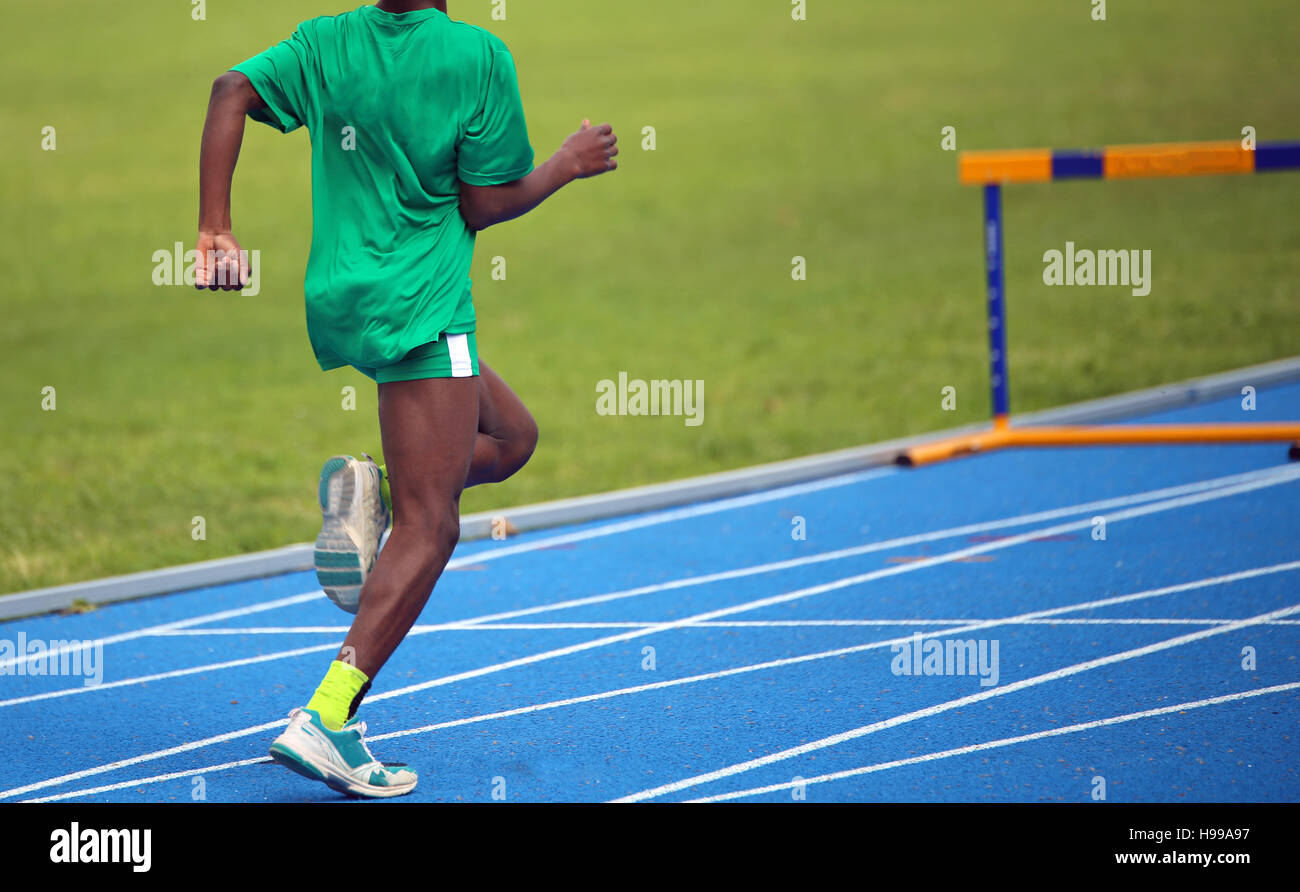 young African athlete during the Hurdling race Stock Photo Alamy