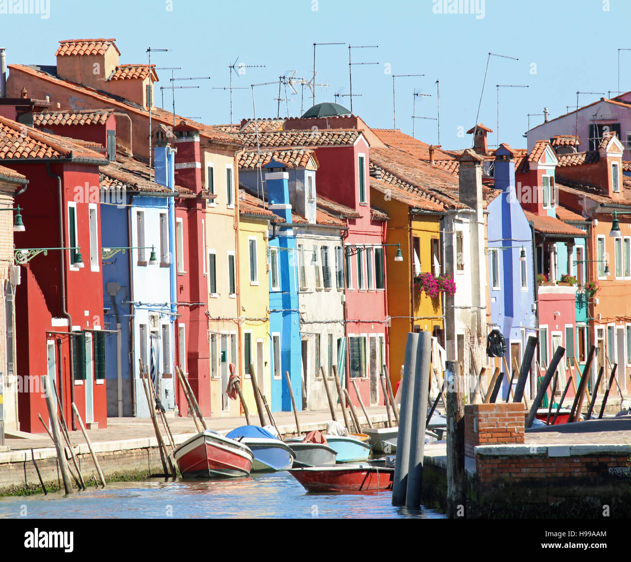 Colourfully painted houses on Canal in Burano island near Venice in ...