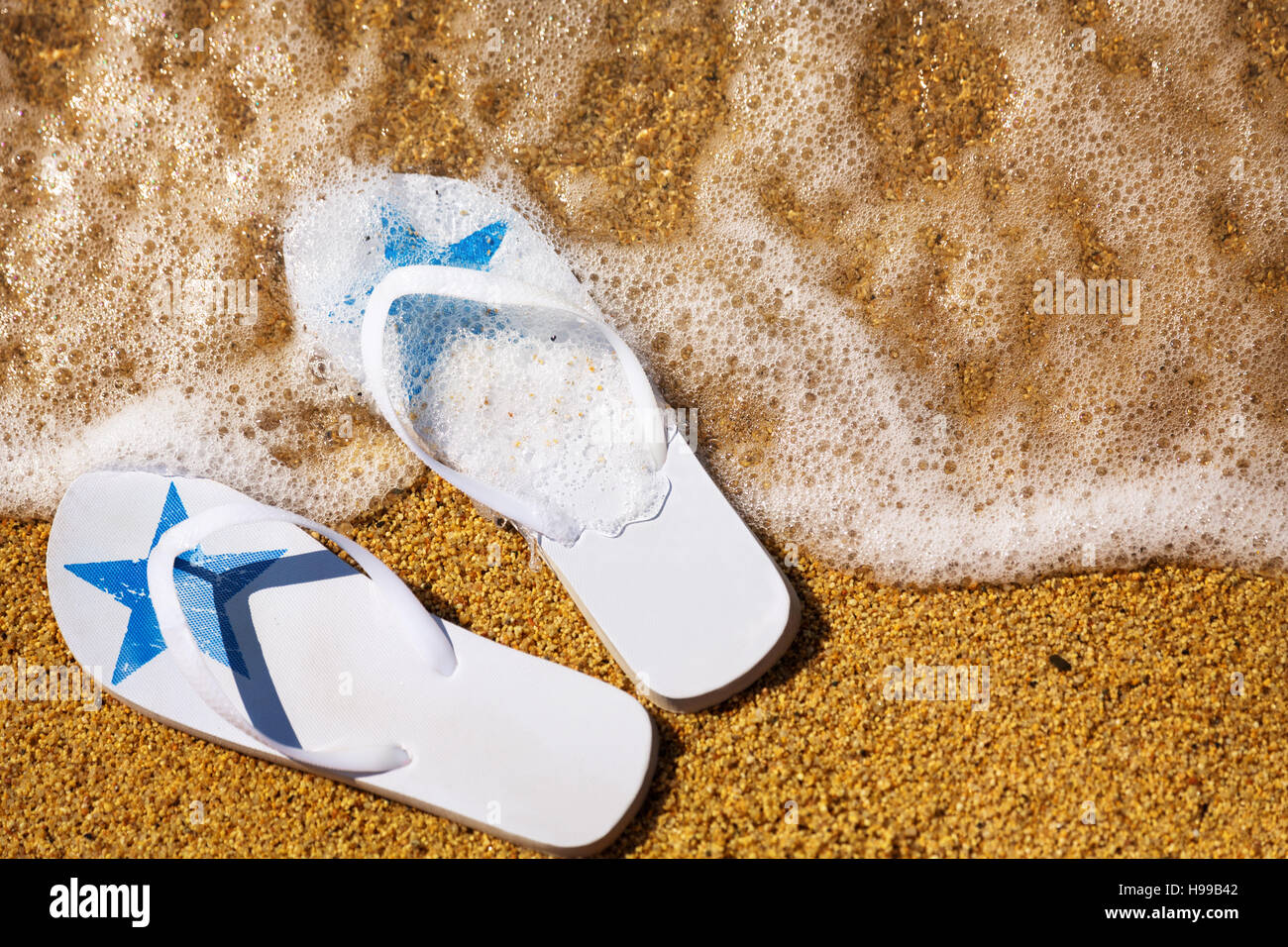 Flip Flops on a Sandy Beach Stock Photo - Alamy
