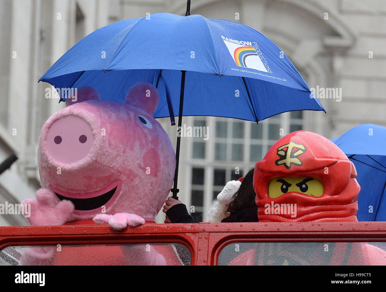 Peppa Pig' and 'Lego Man' on a bus in the second annual Hamleys Christmas  Toy Parade on Regent Street, central London Stock Photo - Alamy