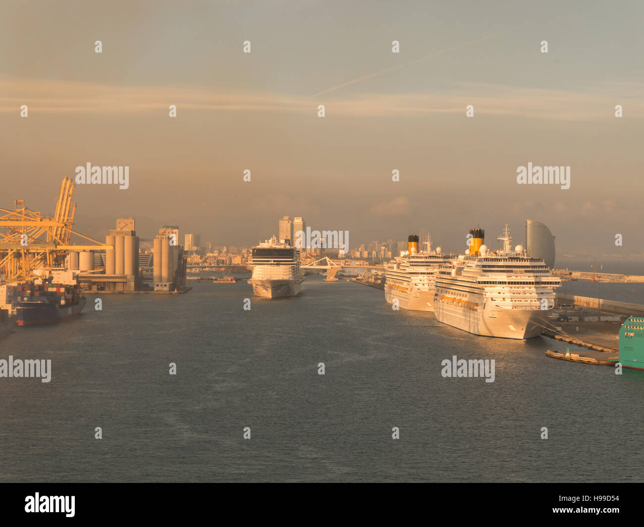 View of Barcelona port with multiple cruise ships taken from Royal Caribbean Harmony of the Seas Stock Photo