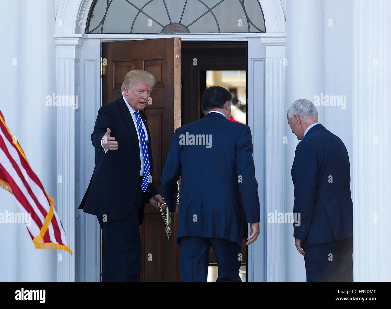 President elect Donald Trump and Vice President elect Mike Pence greet Mitt Romney at the clubhouse at Trump International Golf Club, November 19, 2016 in Bedminster Township, New Jersey. (Aude Guerrucci / Pool) *** Please Use Credit from Credit Field *** Stock Photo