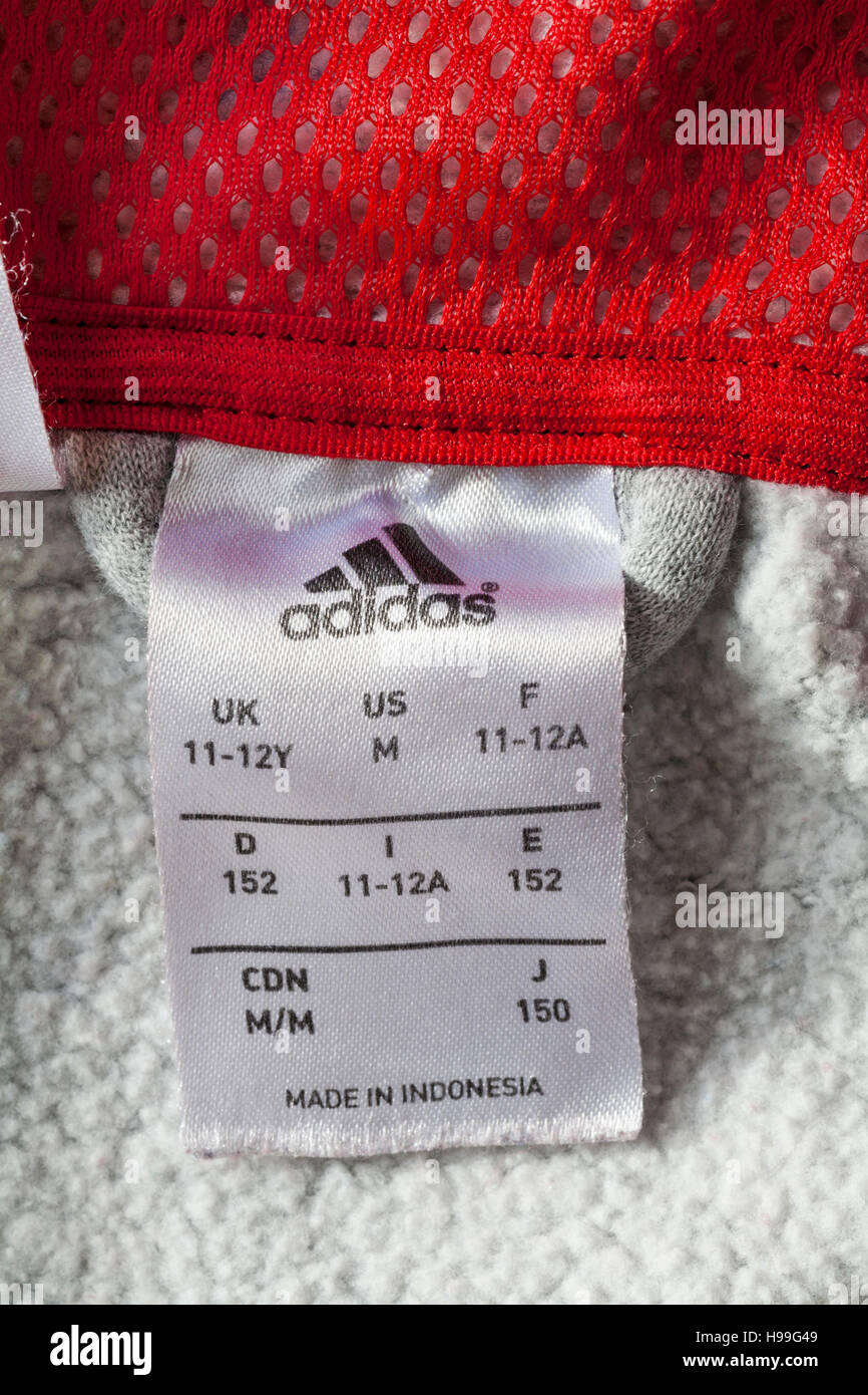 adidas label in hoodie made in Indonesia - sold in the UK United Kingdom, Great Britain Stock Photo