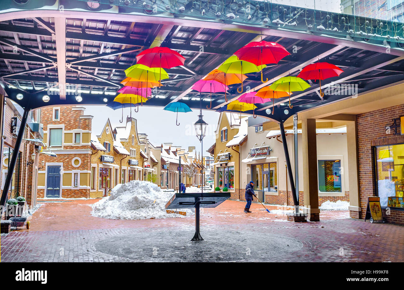 The colorful umbrellas in covered gallery of Dutch style shopping city